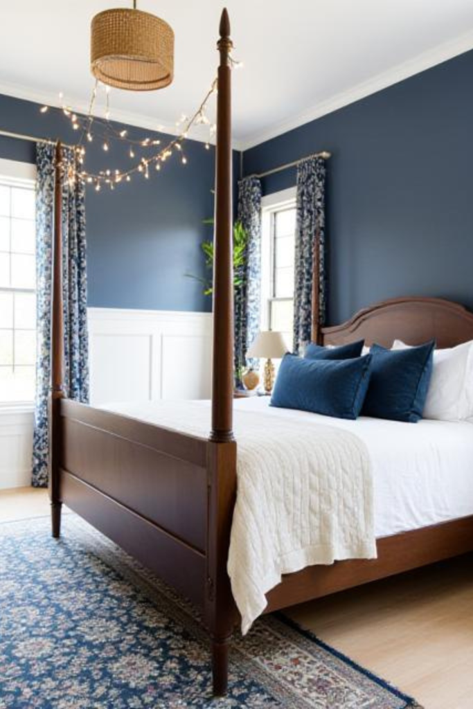 2. Navy Blue Bedroom With Fairy Lights for a Dreamy Atmosphere